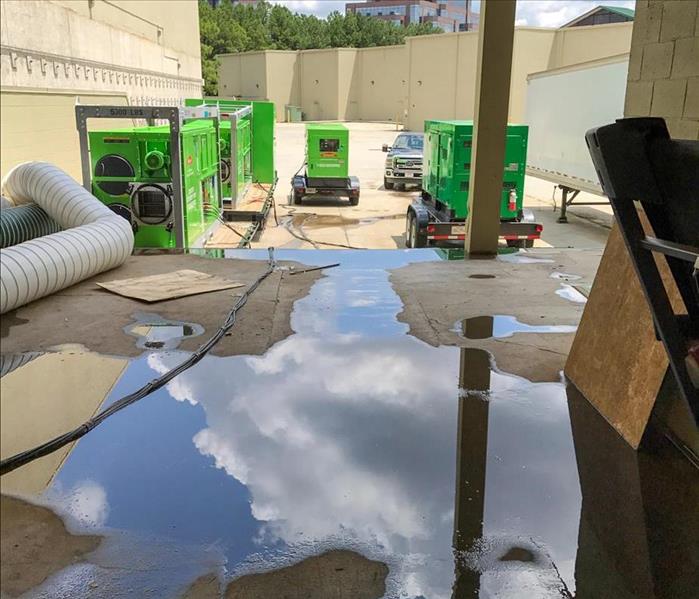 Standing water on the floor of a warehouse