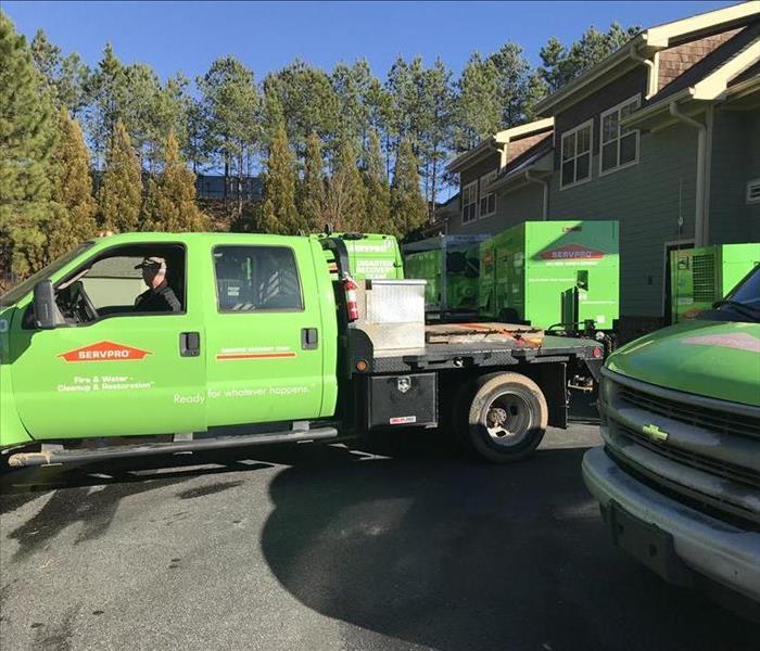 SERVPRO trucks out in front of a residential job